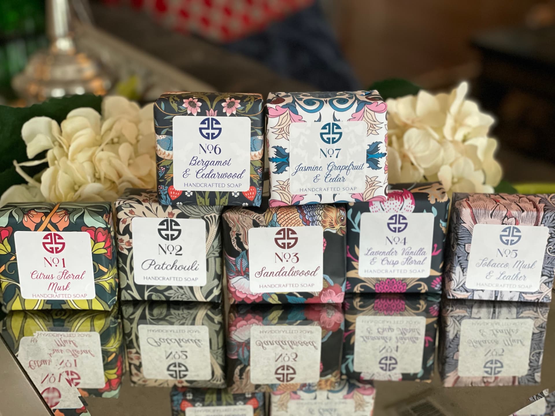 Seventh Sense Home soaps stacked and wrapped by hand in decorative patterned paper